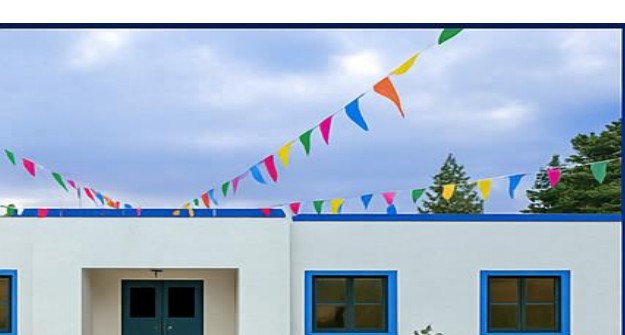 Exterior of a bright, welcoming centre building with colourful bunting